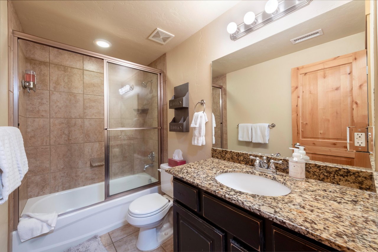Clean and fully equipped, the shared bathroom at Bear Hollow 4402 includes a tubshower combo and granite countertops. Another thoughtful detail that makes this Park City lodging ideal for families an