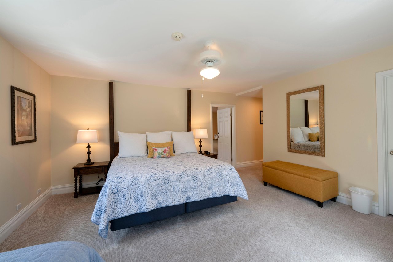 Rest and recharge in the luxurious king bedroom at Resort Plaza 5004 — this Park City vacation rental offers a serene and spacious primary suite with soft neutral tones and elegant furnishings for the