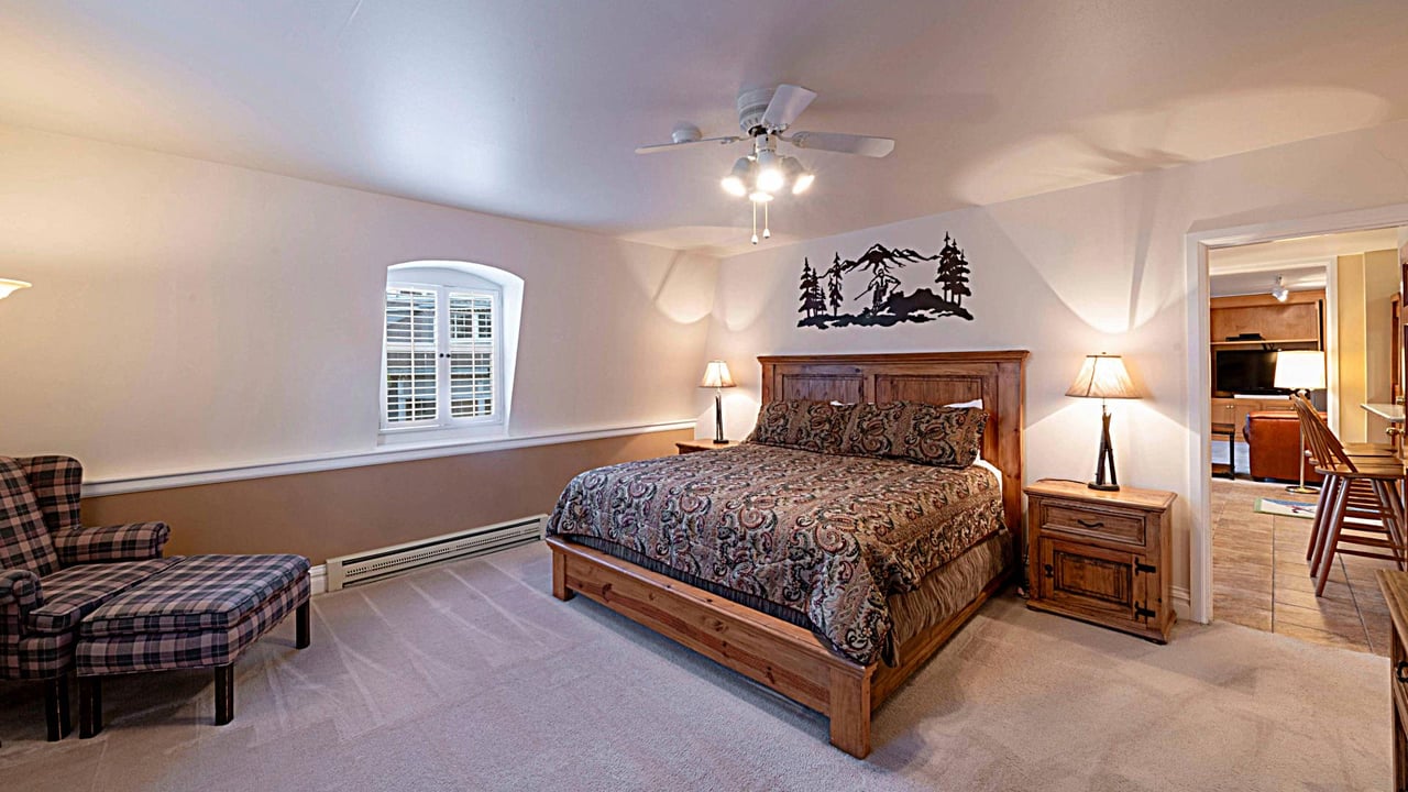 Enjoy a peaceful nights sleep in the spacious king bedroom at Resort Plaza 5013 — a charming Park City vacation rental with warm mountain décor and plenty of natural light.