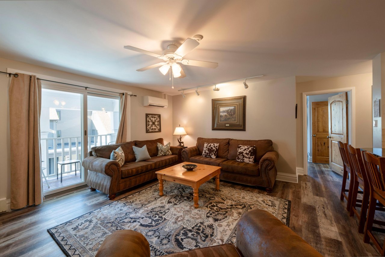 Relax in the bright and airy living room at Resort Plaza 5022 — a charming Park City vacation rental with comfortable seating and warm mountaininspired décor.