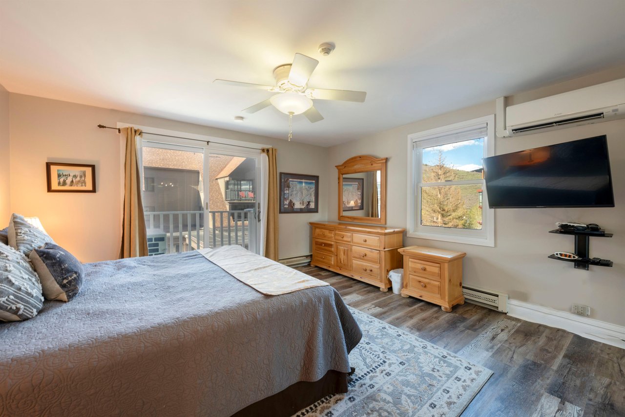 Resort Plaza 5022 offers a lightfilled king bedroom with scenic views and classic mountain décor — a comfortable and inviting choice for Park City condo rentals and Park City lodging.