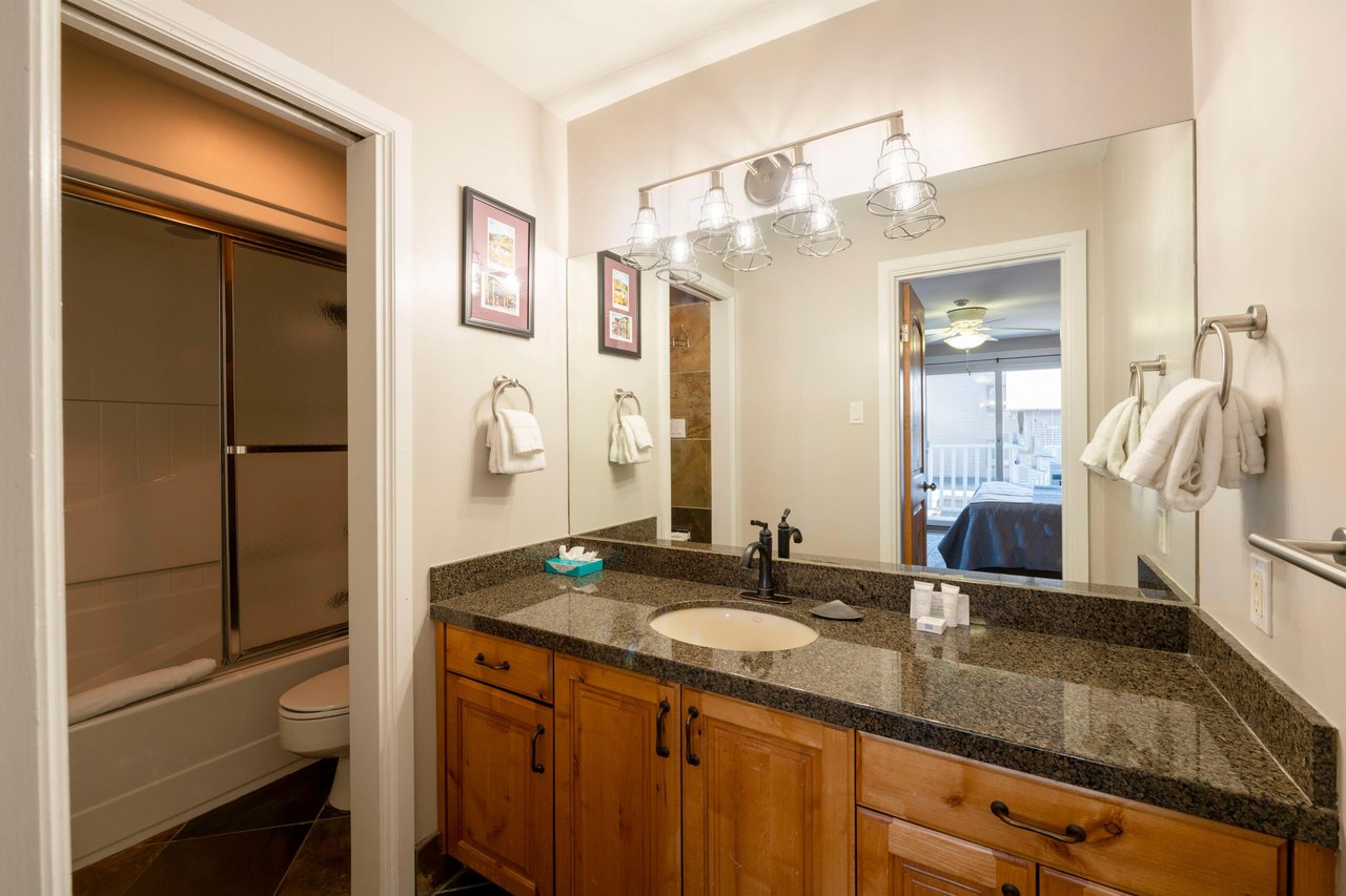 Freshen up in the wellappointed bathroom at Resort Plaza 5022 — a polished and comfortable detail that elevates this Park City condo rental above other Park City lodging options.