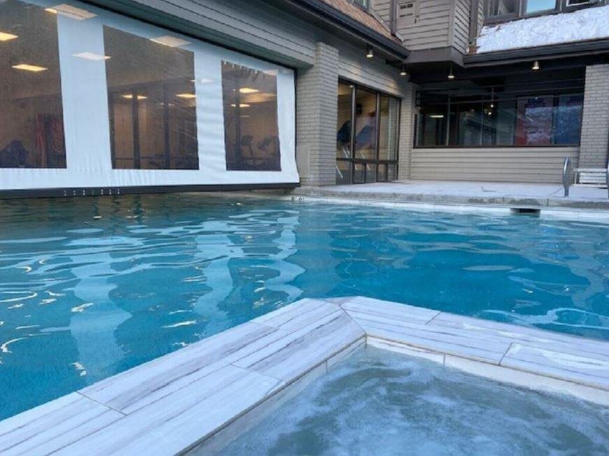 Unwind poolside at Resort Plaza 5022 — a fantastic outdoor pool and hot tub area that makes this Park City condo rental one of the best options for Park City lodging.