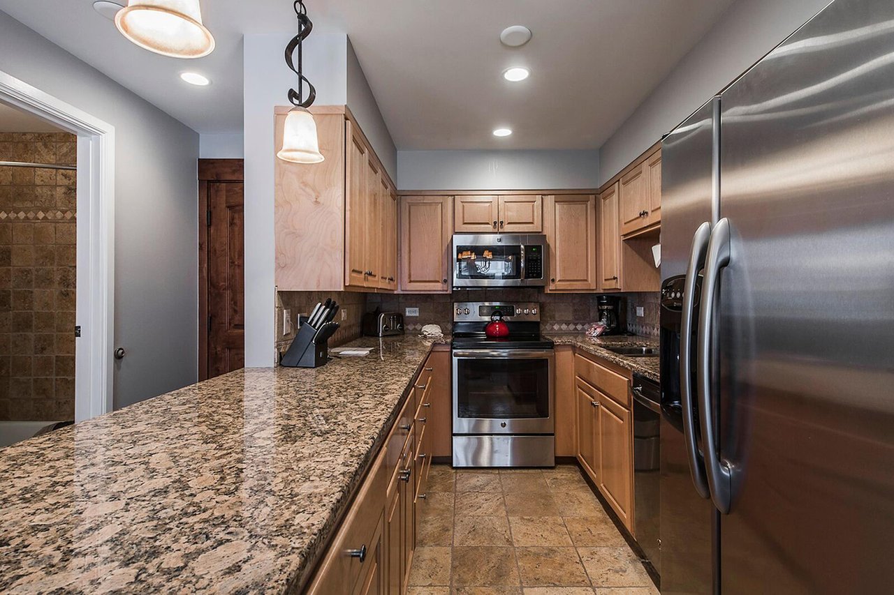 Cook up something delicious in this fully equipped kitchen, featuring granite countertops and stainless steel appliances. Everything you need for a comfortable Park City vacation rental experience