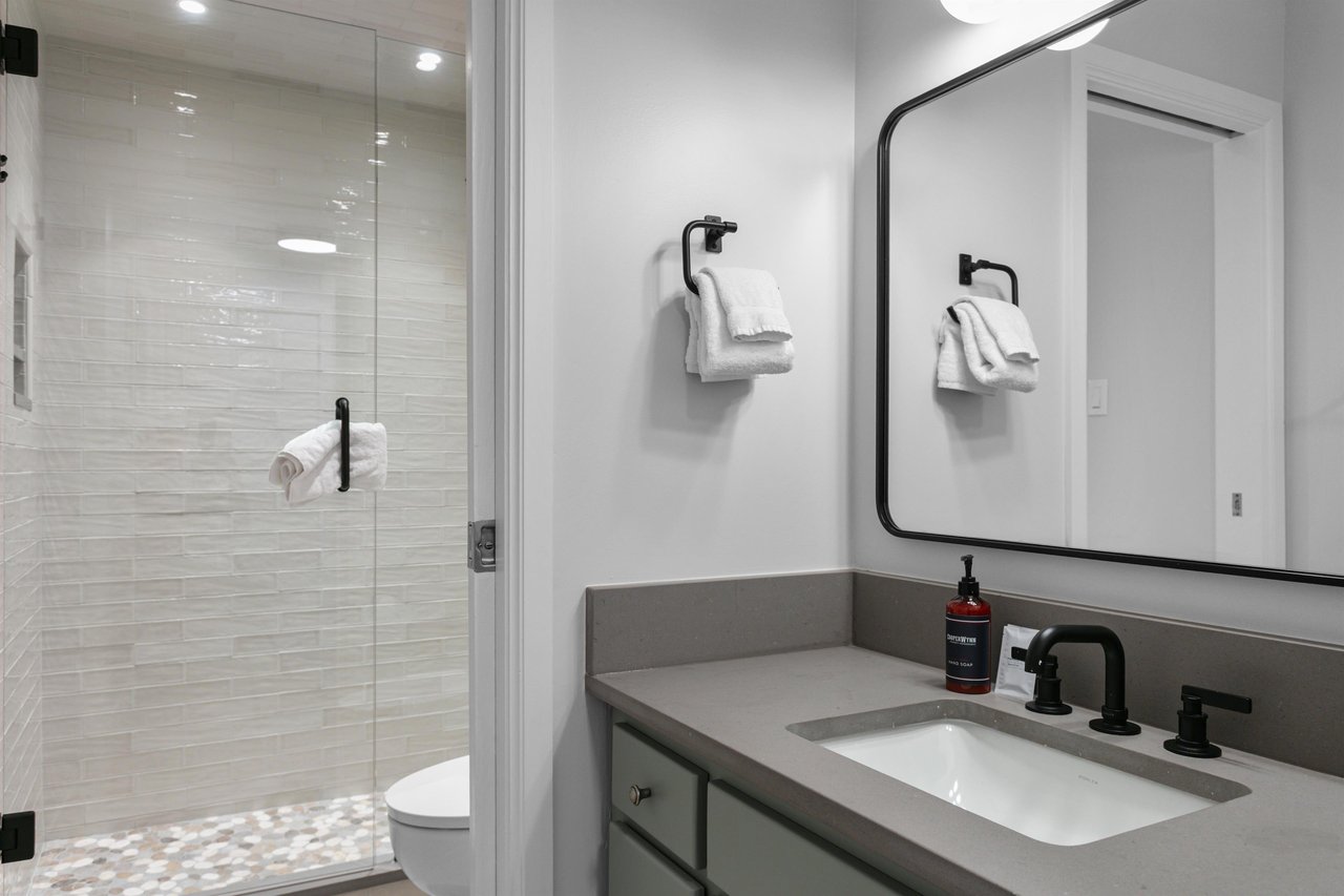Clean lines, modern fixtures, and a spalike atmosphere make this bathroom a standout feature of Resort Plaza 5025. Elevate your Park City lodging experience with upscale amenities at every turn.