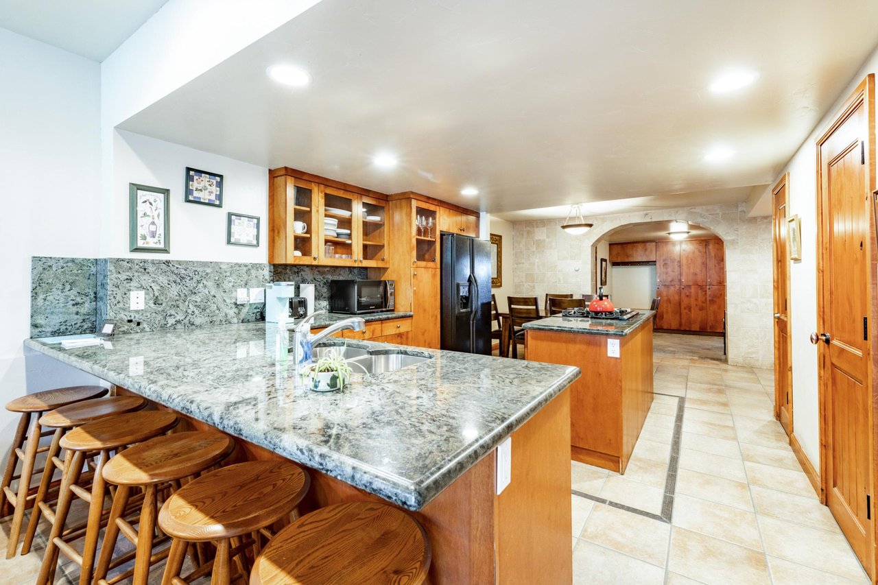 Spacious, stylish, and built for entertaining — the stunning openconcept kitchen at Park Avenue 245 makes every meal an event during your Park City stay.