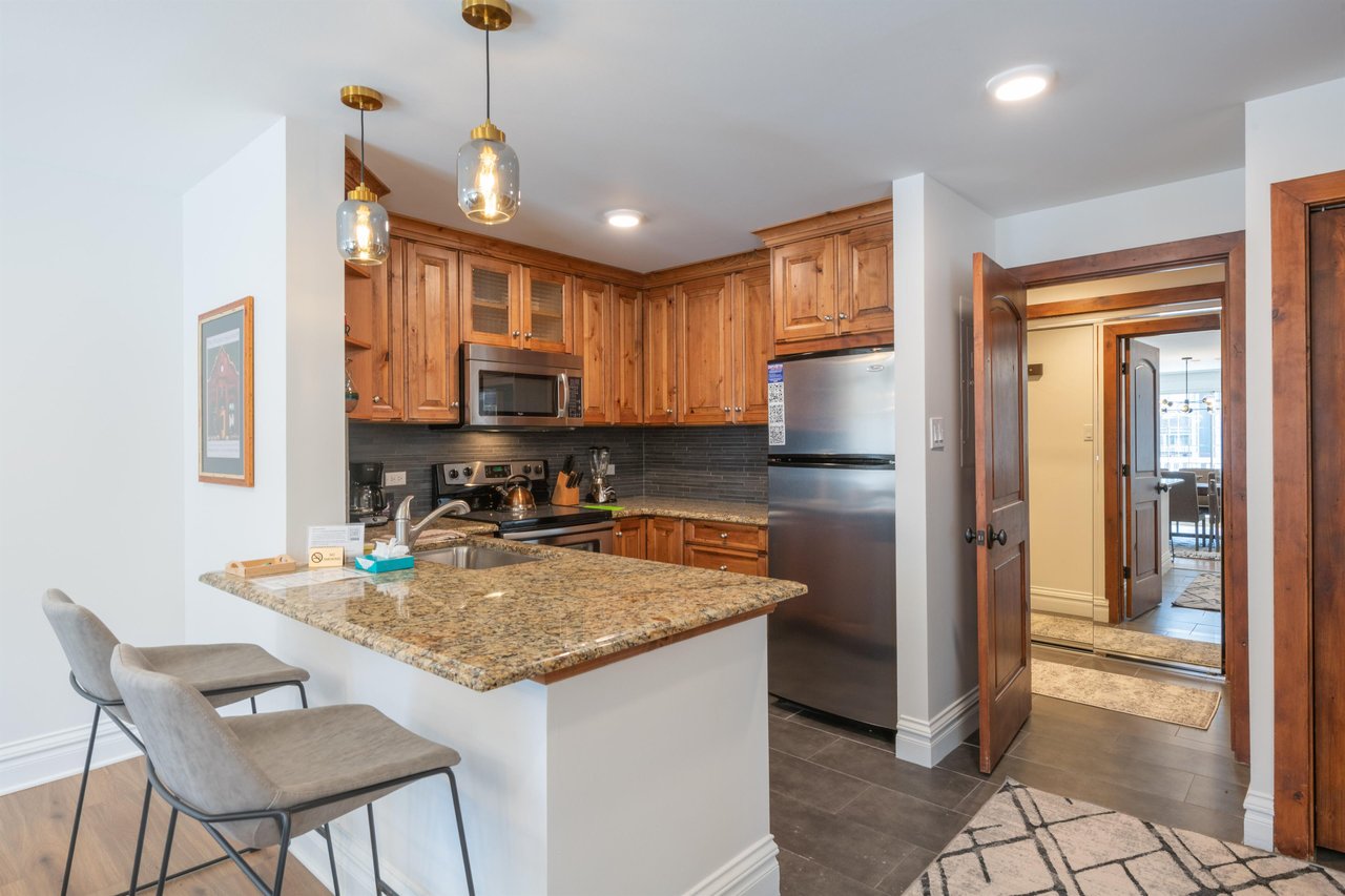 Warm, functional, and beautifully appointed, this fully equipped kitchen with granite island seating is perfect for everything from quick breakfasts to full group dinners. Just one of the many highlig