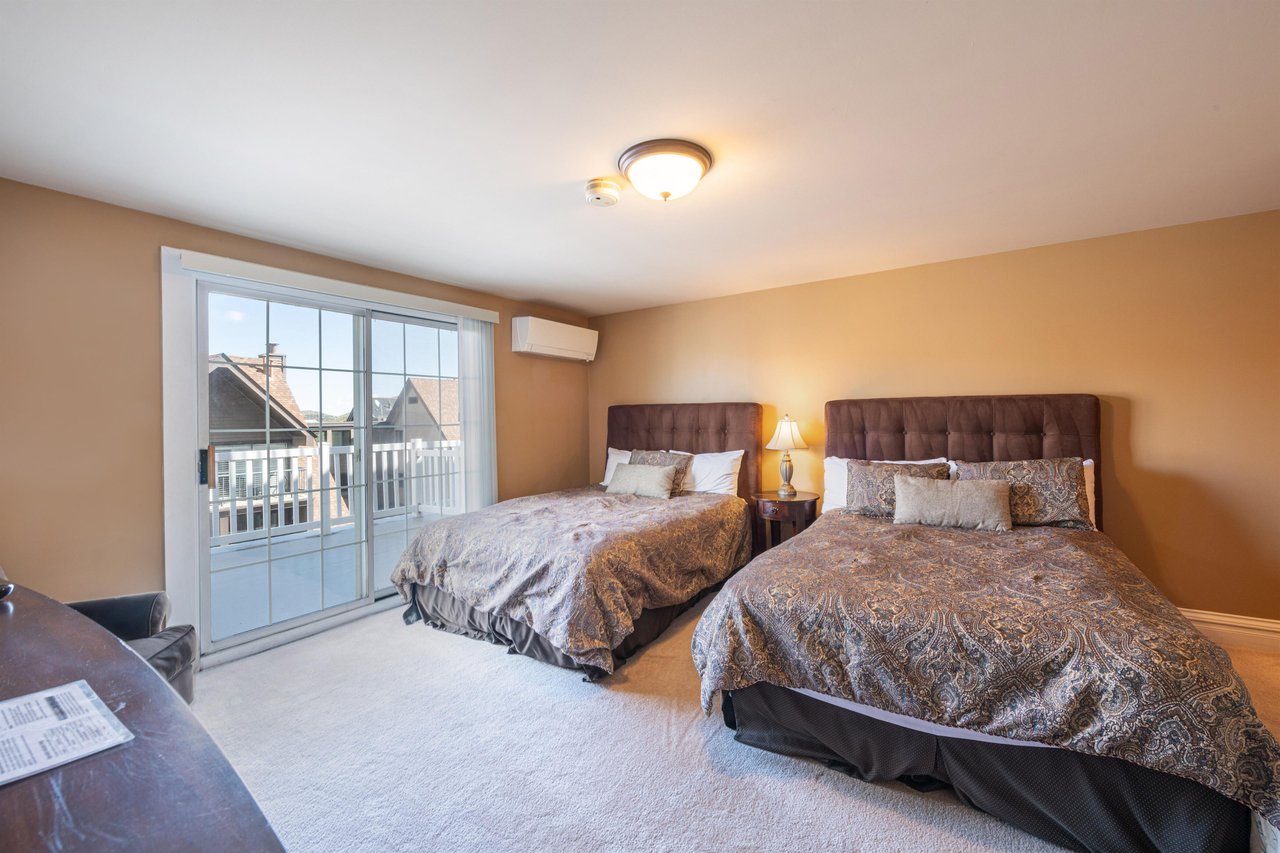 Stylish upholstered headboards, balcony access, and two queen beds make this second bedroom a welcoming and restful retreat. Resort Plaza 5031 offers Park City lodging with enough space and comfort fo