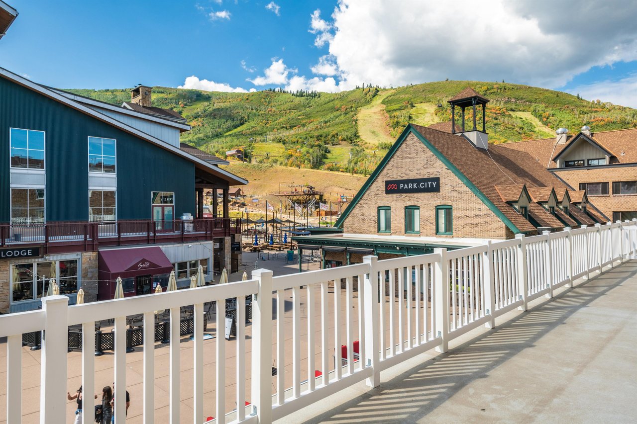The deck at Resort Plaza 5031 frames a spectacular view of the resort village and surrounding mountain landscape, making it the perfect spot to unwind and soak it all in. Park City lodging simply does