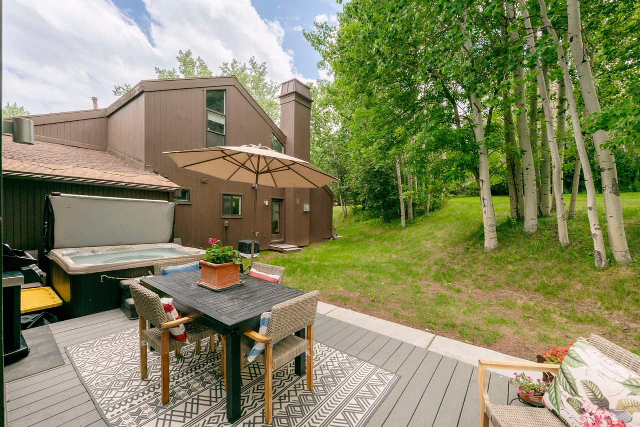 Three Kings 93 offers a stunning private deck surrounded by lush aspen trees and wide open green space, creating a serene outdoor retreat that makes this Park City vacation rental a true nature lover