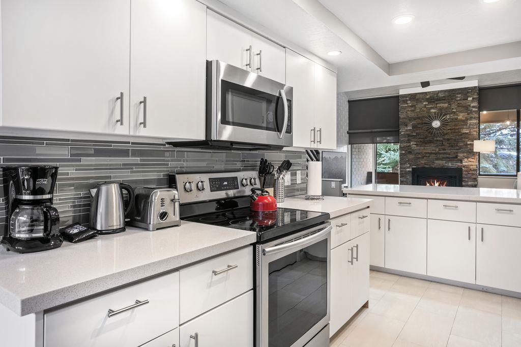 The beautifully appointed kitchen at Park Avenue 296 leaves nothing to be desired. Sleek white cabinetry, stainless steel appliances, and modern finishes make cooking a pleasure during your Park City 