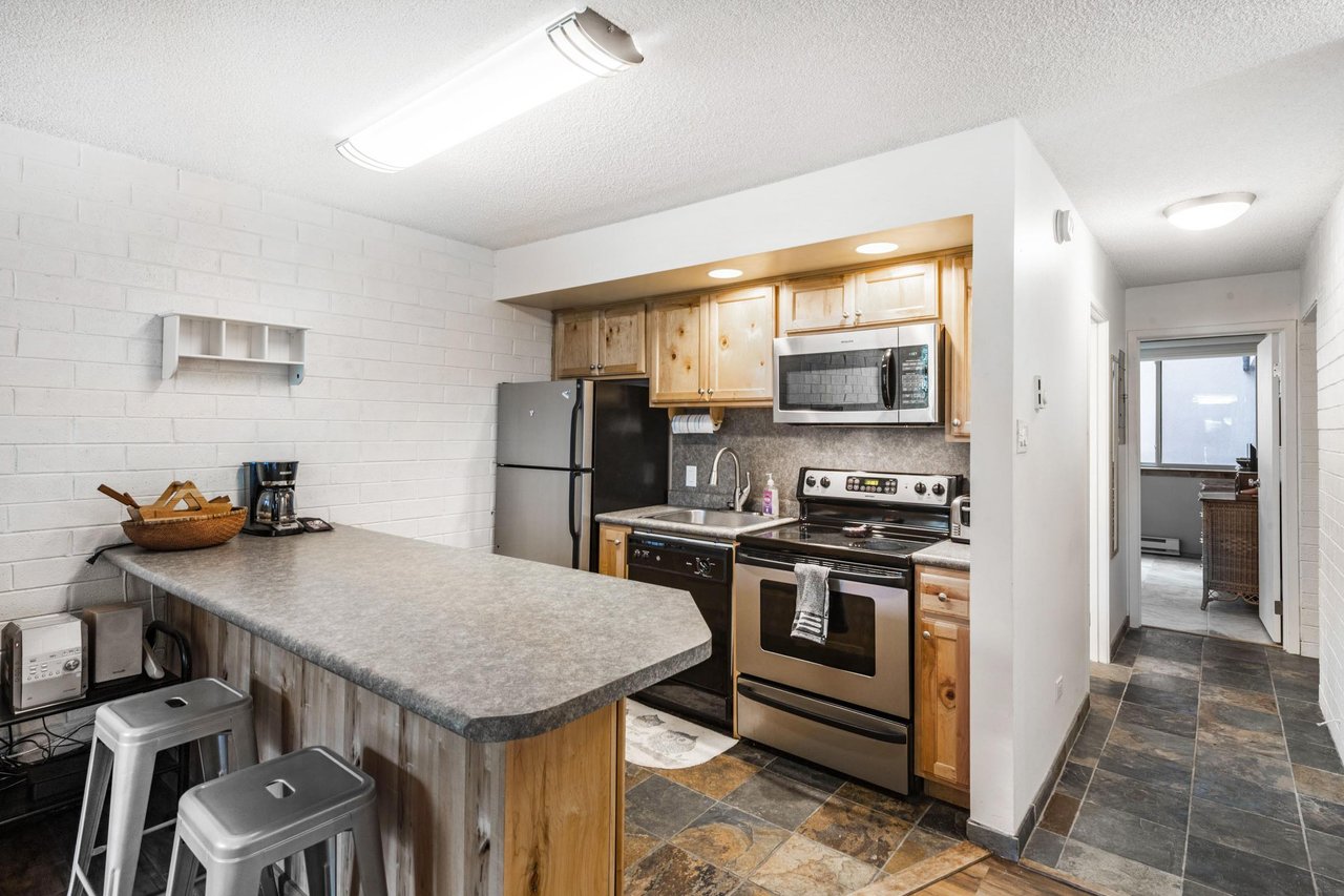 Cook up your favorite meals in the charming and fully stocked kitchen at Park Avenue 297. With stainless steel appliances and ample counter space.