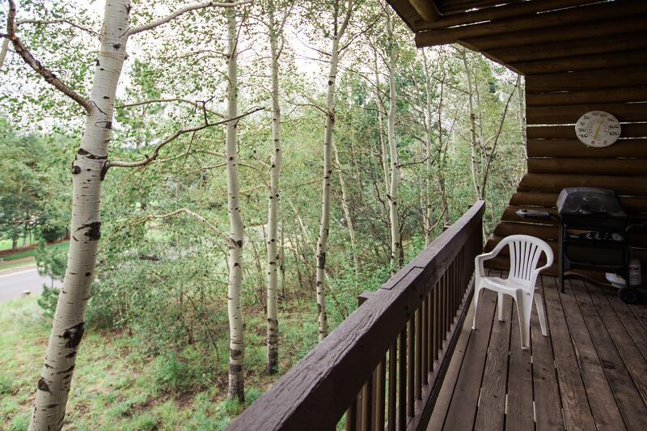 Step out onto the private deck at Temptation 8 and immerse yourself in a serene canopy of aspen trees — a peaceful and rejuvenating outdoor escape at this Park City vacation rental.