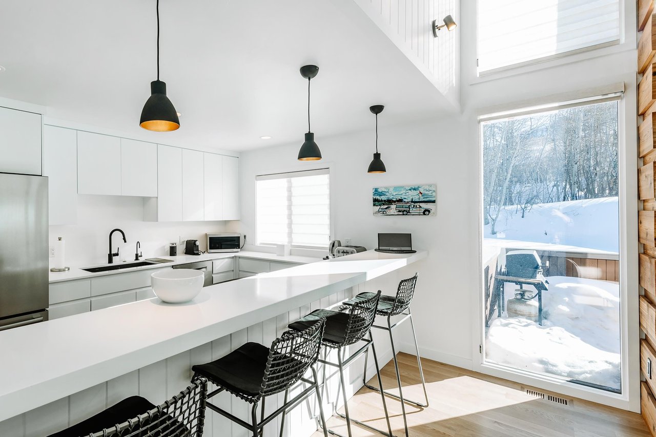 Bright, bold, and beautifully designed, the contemporary kitchen at Three Kings 80 is just one of the many reasons it stands out as a premier Park City lodging option.