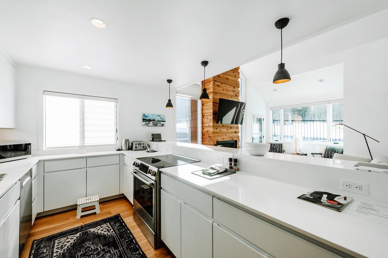 Natural light, clean lines, and warm wood details come together beautifully in the kitchen at Three Kings 80.