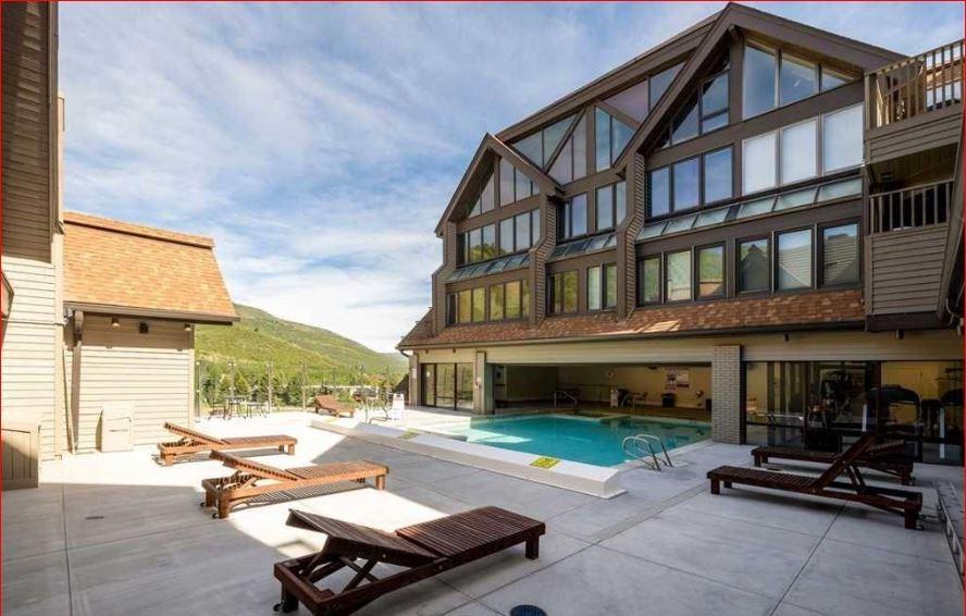 Soak up the stunning mountain scenery from the indooroutdoor community offsite pool and sundeck accessible to Resort Plaza guests.