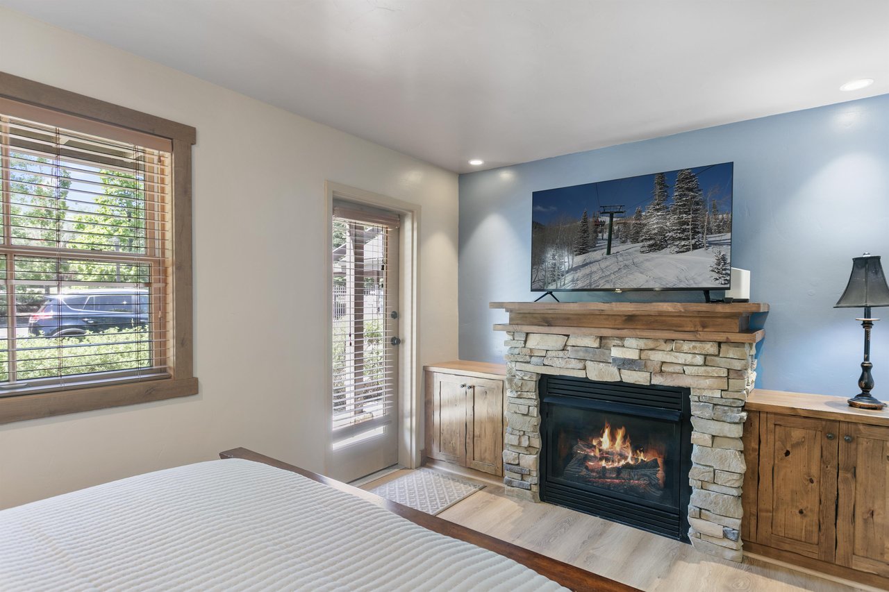 A crackling fireplace, mountainthemed décor, and private outdoor access make this a comfortable retreat after a full day out.