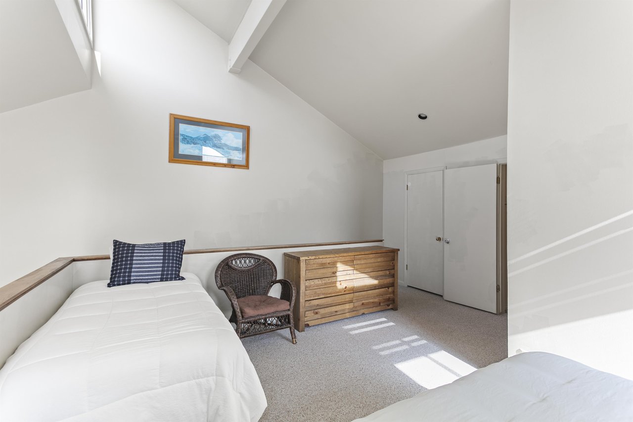 Relax in your peaceful loft retreat, where vaulted ceilings and soft natural light create a bright, airy space. Settle into the cozy seating and enjoy ample storage for all your belongings.