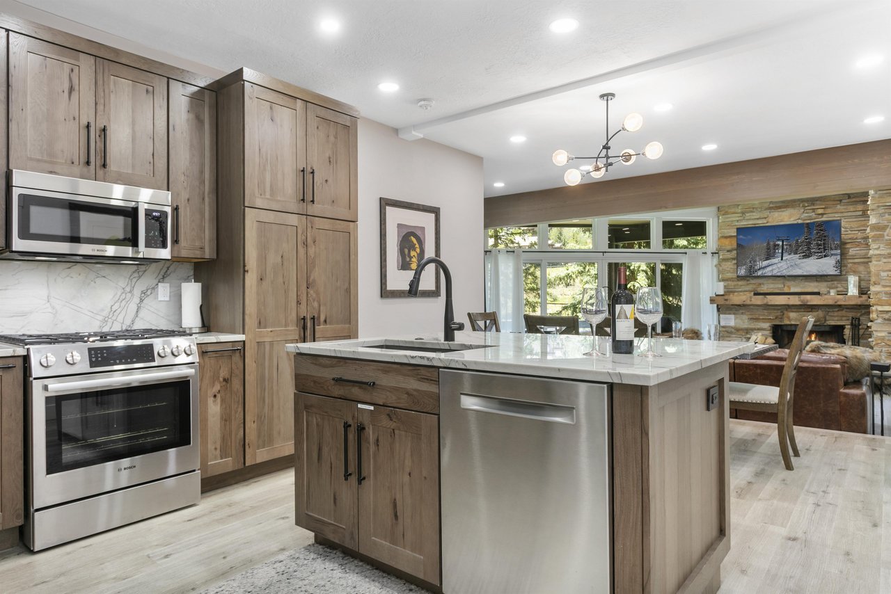 From the oversized quartz island to the custom wood cabinetry and premium stainless steel appliances, the kitchen at Powder Run C13 delivers a truly luxurious Deer Valley condo rental experience for