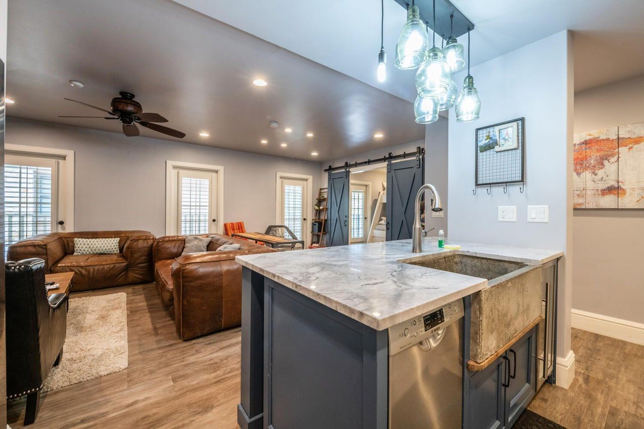 The kitchen island at Resort Plaza 5000 offers casual bar seating for the group — another reason this renovated Park City condo rental is the ideal home base for families and groups who love to cook a