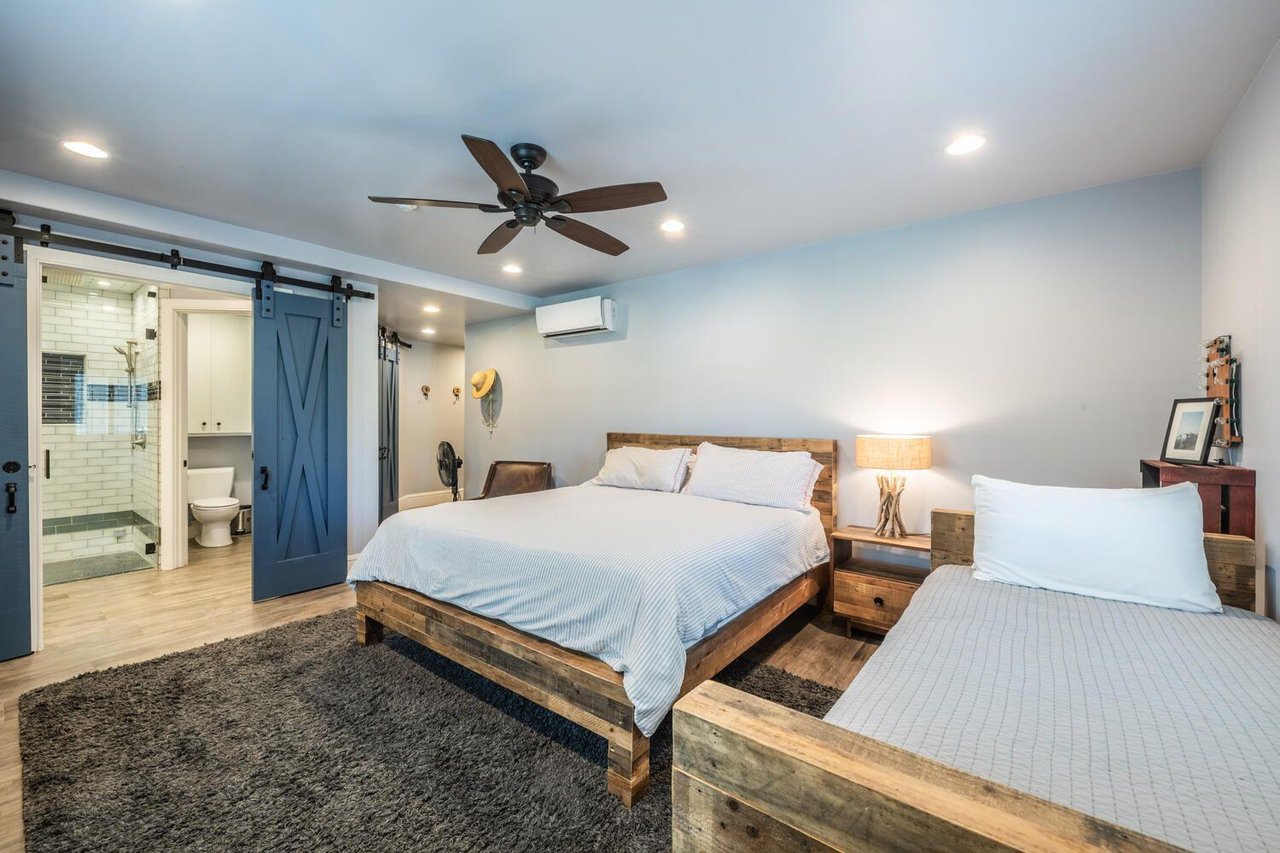 The guest bedroom at Resort Plaza 5000 features a king bed plus a twin bed — a comfortable and stylish Park City lodging retreat for additional guests.