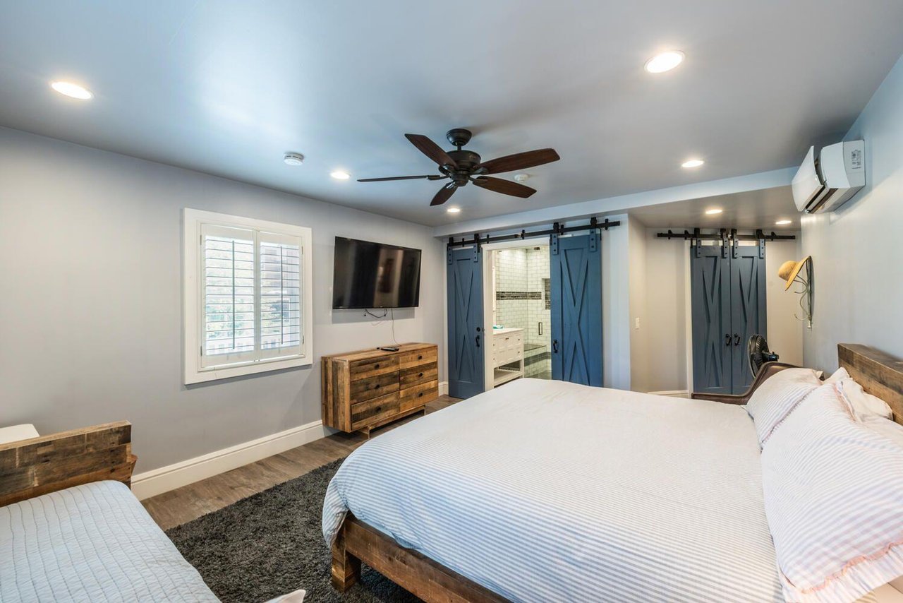 Wellappointed and welcoming, this guest bedroom at Resort Plaza 5000 offers a flatscreen TV, generous storage, and all the comforts that make this Park City condo rental a true home away from home.