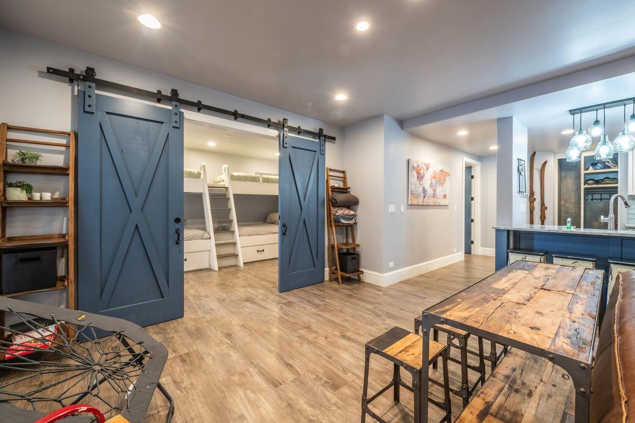 The charming barn door entry at Resort Plaza 5000 is just one of the design details that set this renovated Park City condo rental apart — a warm, characterful touch that reflects the care and quality