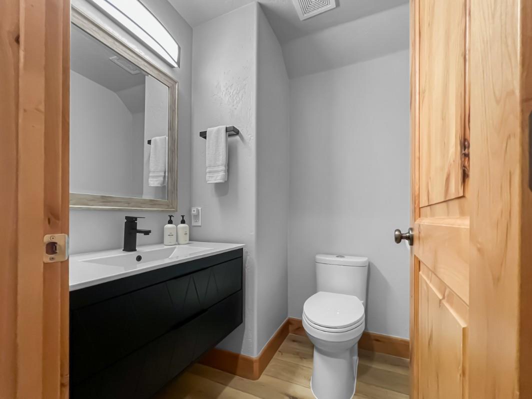 Step into your freshly updated bathroom, where a sleek floating vanity and soft gray walls create a calming retreat. Fresh towels await and thoughtful amenities are within reach.