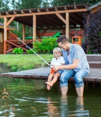 Dad and son fishing in lake 1