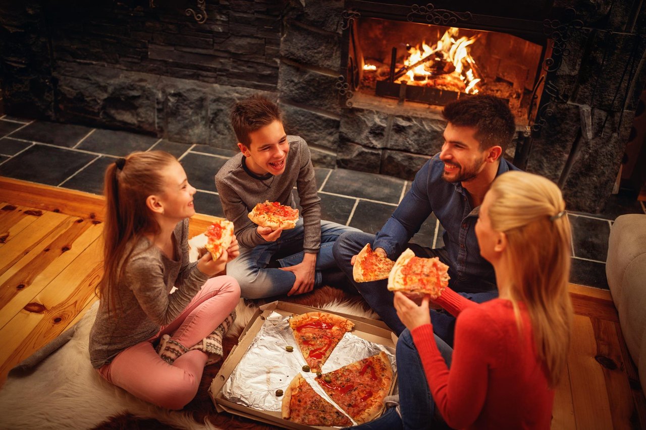 Family eating in cabin