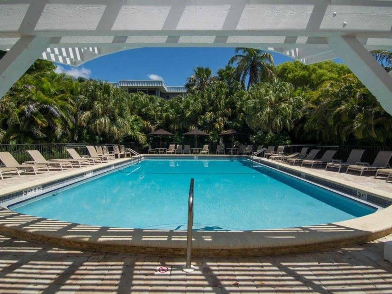 The outdoor swimming pool at Island Beach Club