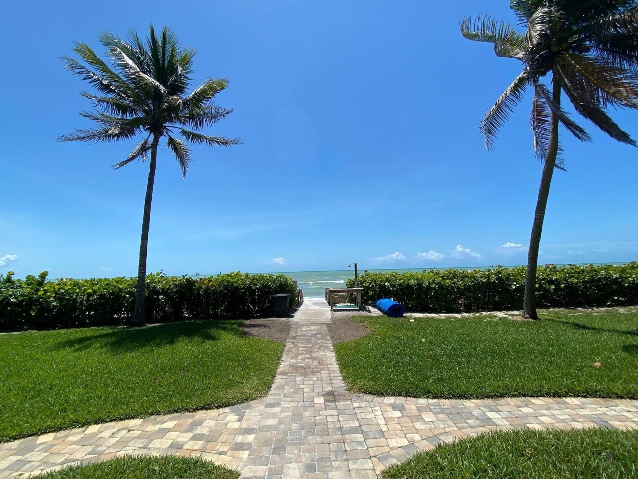 A pathway leading to the beach at Island Beach Club