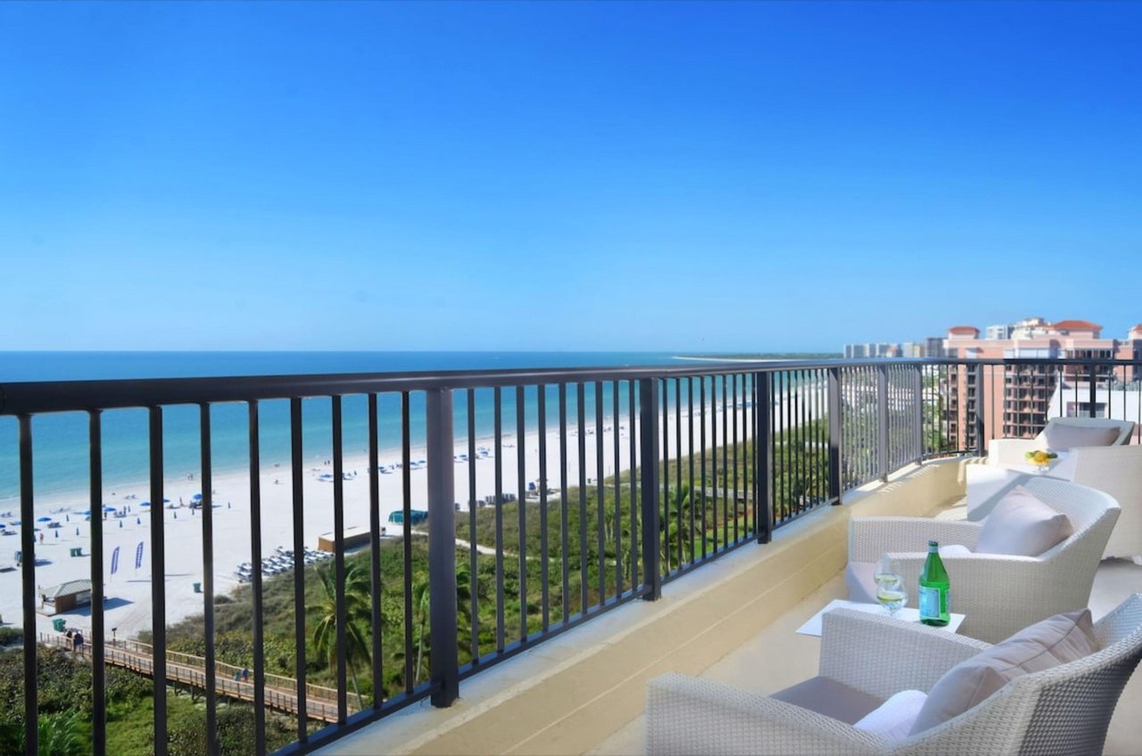 A balcony overlooking the beach at Hilton Marco Island Beach Resort and Spa