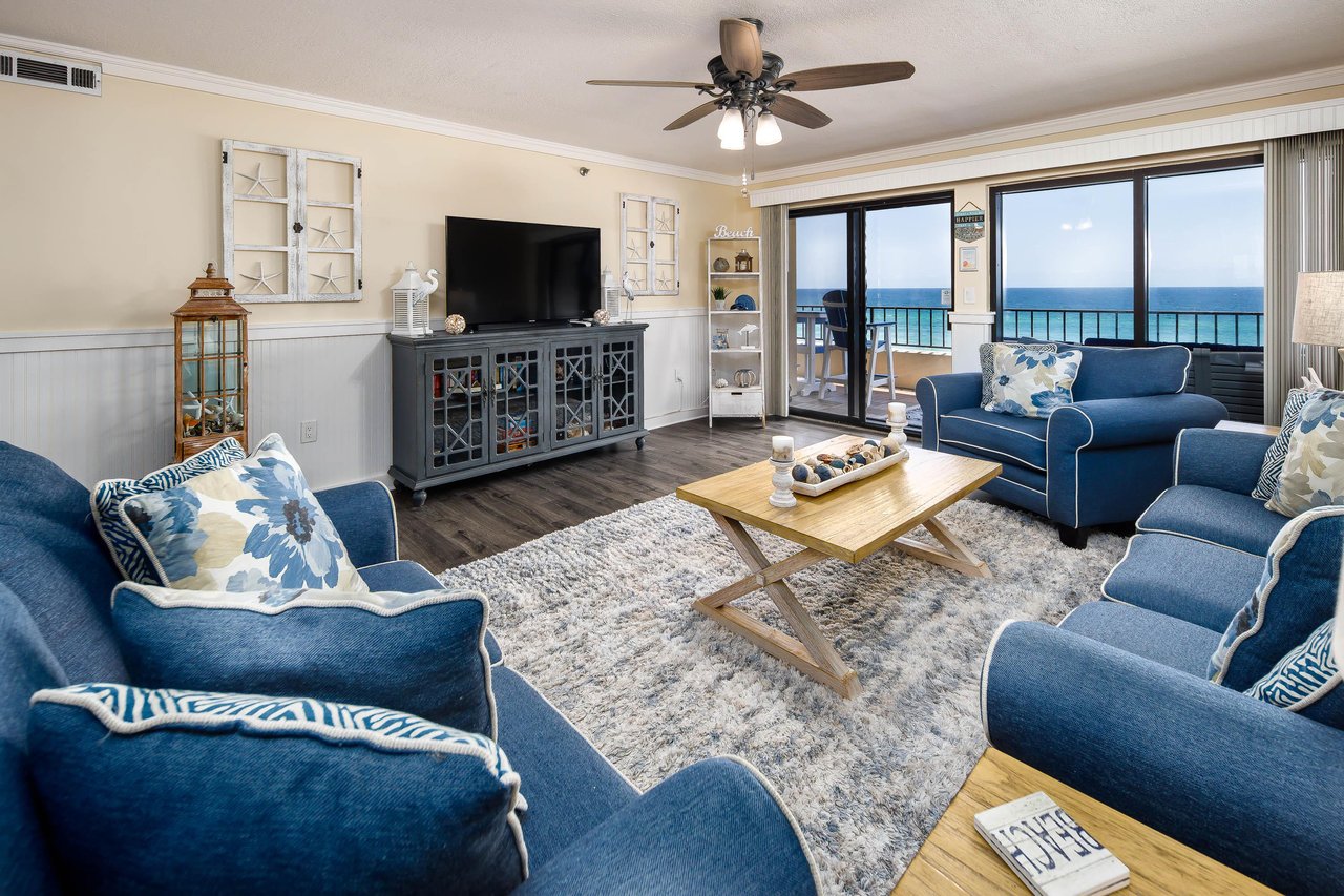 Plenty of seating in the living room with spectacular views of the beach