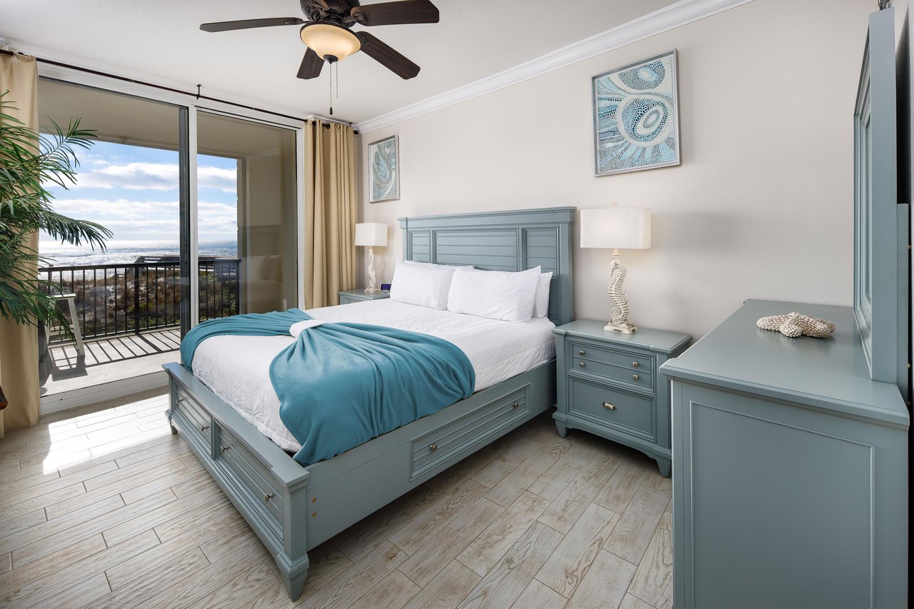 Charming primary bedroom with balcony access and direct access to a full bath with a walkin shower and jacuzzi tub.