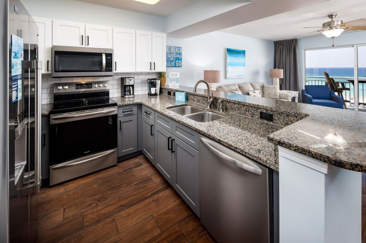 Gourmet Kitchen Sleek granite counters and ocean views make cooking a delight in this stylish space