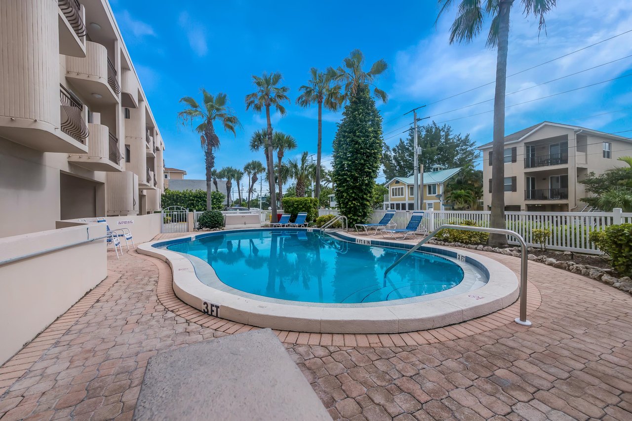 Community Pool with Lounge Chairs