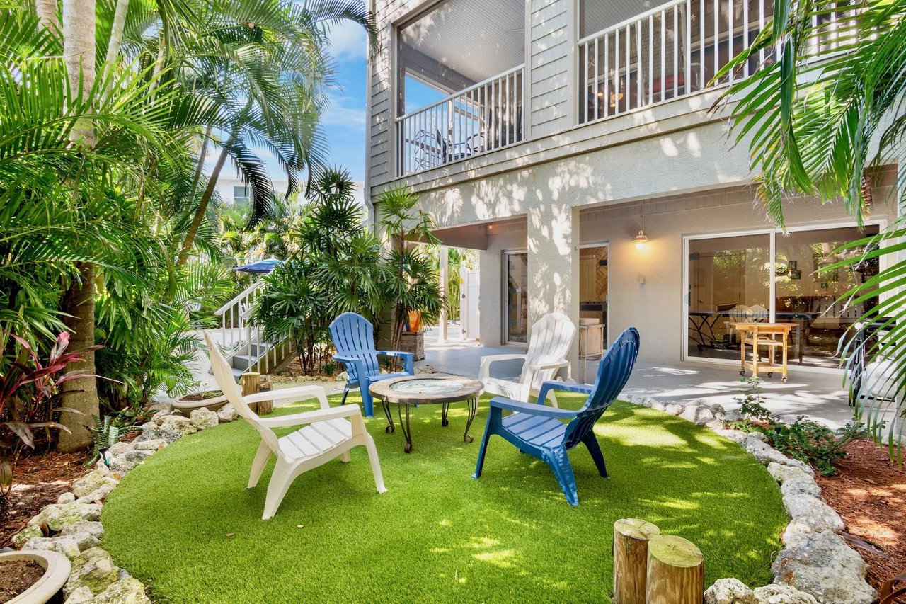 Colorful lounge chairs on lush green turf