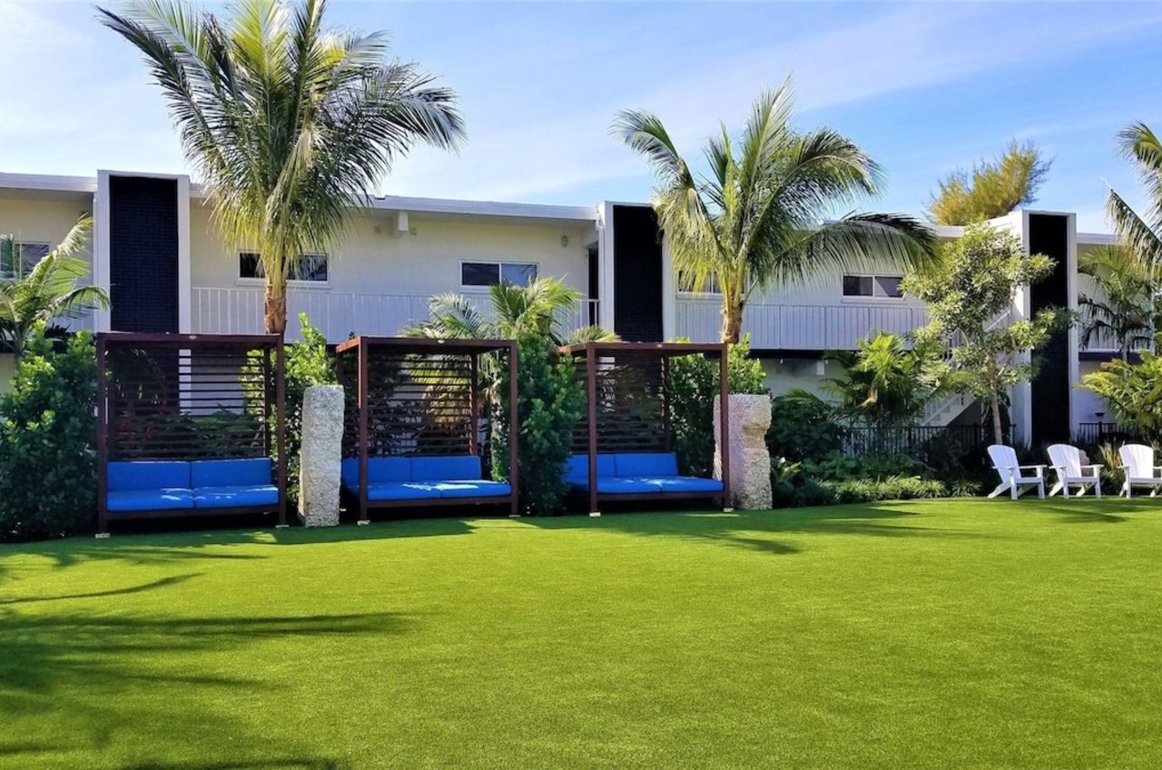 The lounge chairs and cabana at Bali Hai Beachfront Resort and Spa