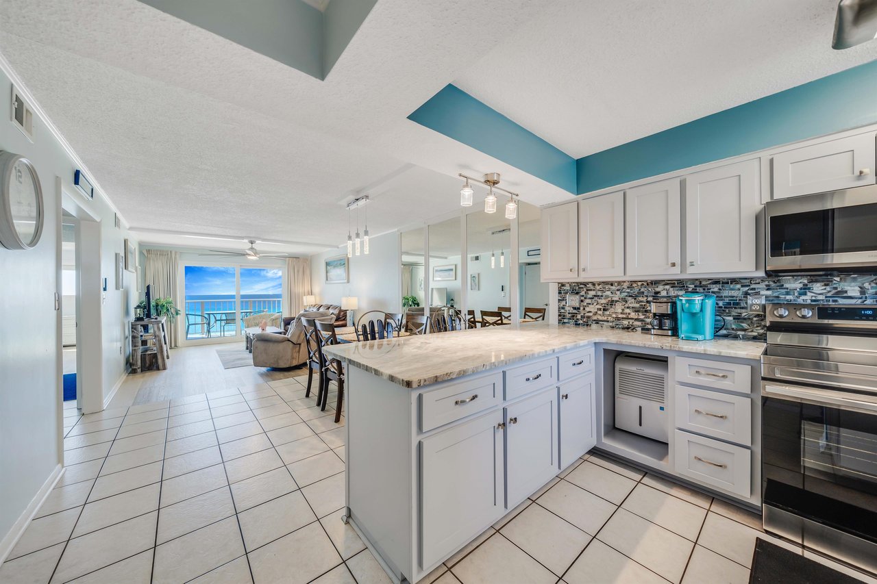 The updated, fully equipped kitchen features quartz countertops, stainlesssteel appliances, and has everything you need to prepare meals for family  friends.