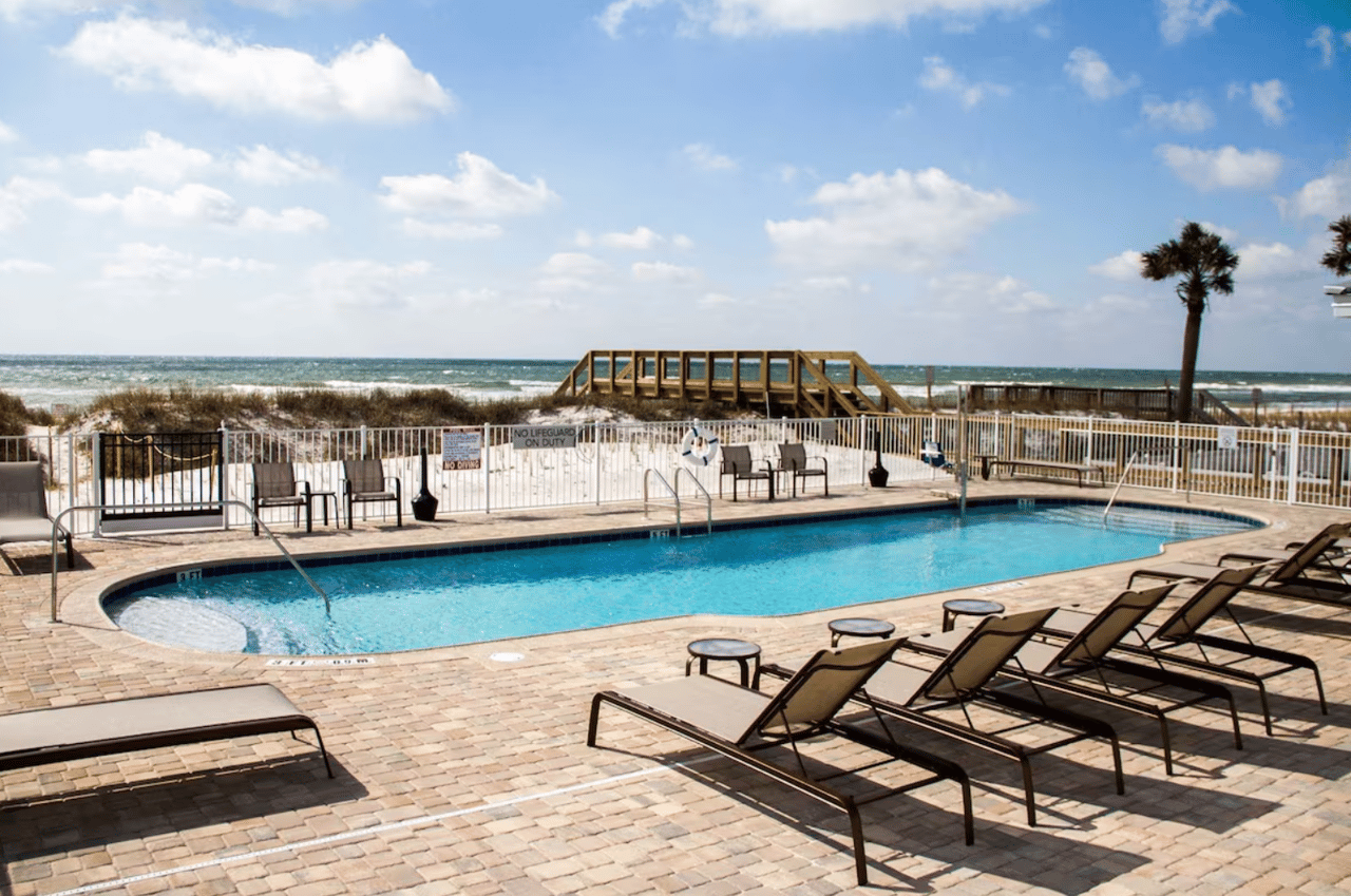 beachside pool and pool loungers at Sundrift Inn Fort Walton Beach, Florida