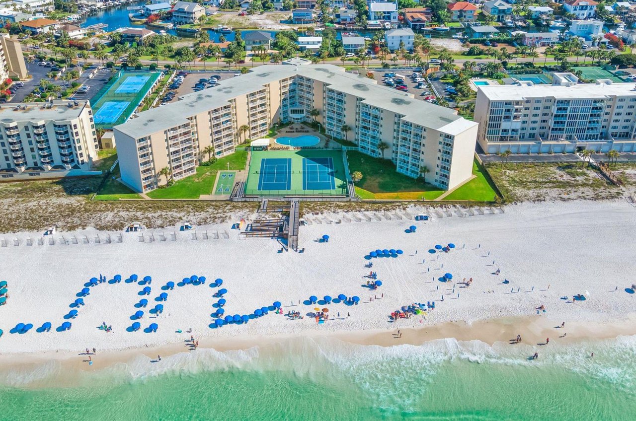 The community is s short boardwalk from the glistening coastline.