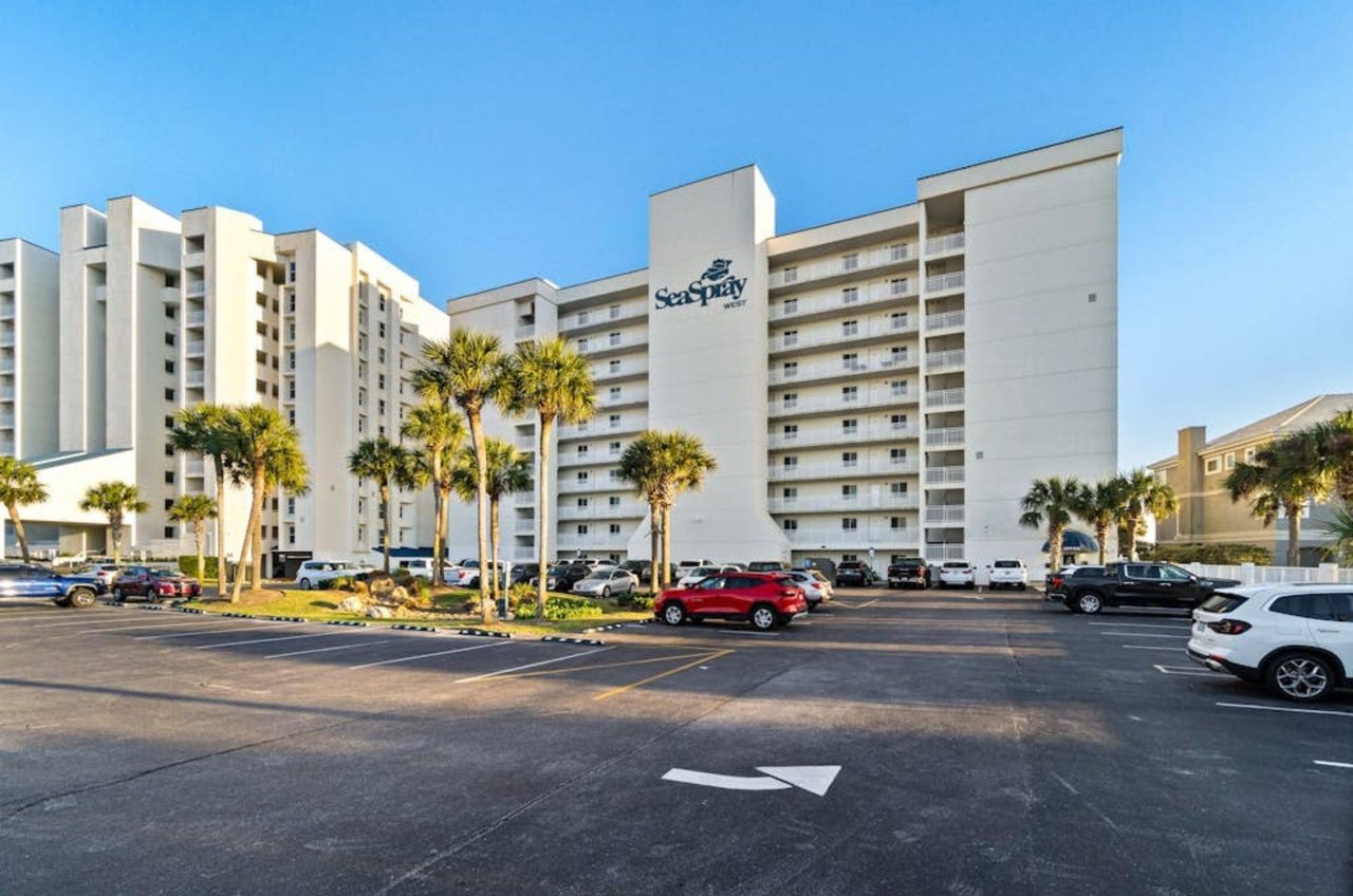 View from the street of the exterior fo SeaSpray West with complimentary parking out front