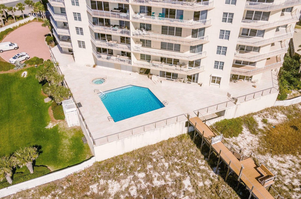 Aerial view of the outdoor pool and boardwalk to the beach