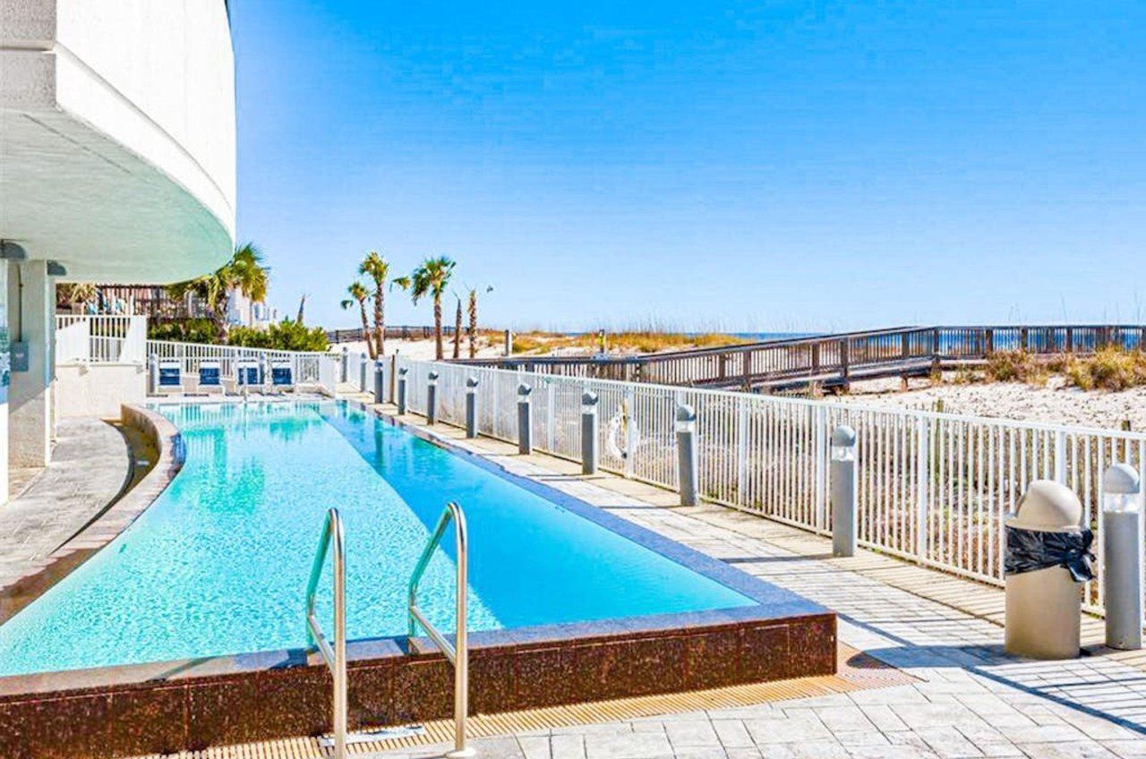 The outdoor swimming pool in front of Island Tower in Gulf Shores Alabama