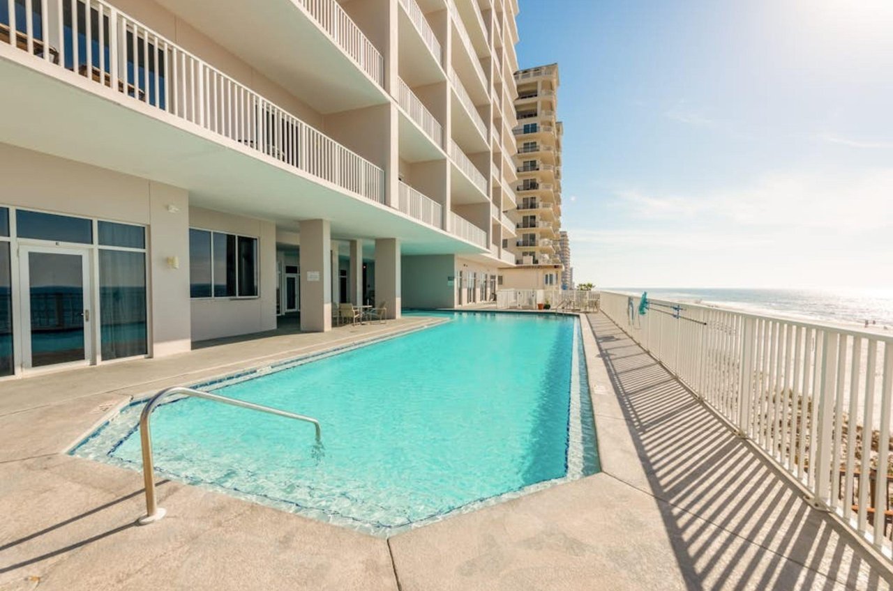 The long outdoor swimming pool in front of Windemere Condominiums in Perdido Key Florida