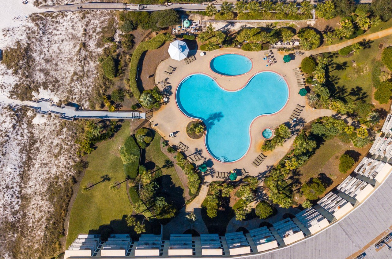 Crescent Condominiums swimming pool and hot tub deck opens to a boardwalk leading directly to the beach.