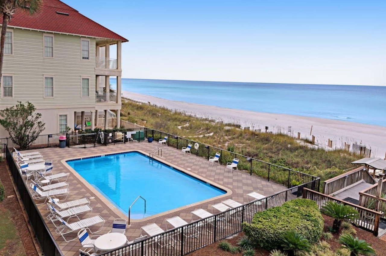 A balcony view of Huntington by the Seas beachside swimming pool spacious sundeck and boardwalk to the beach