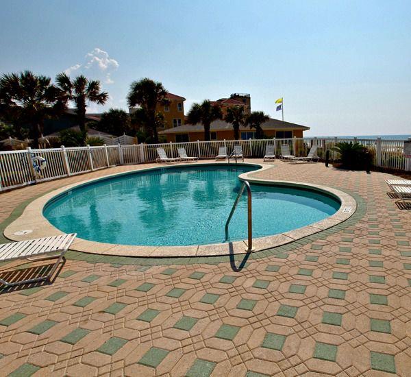 Enjoy relaxing around the pool at Windancer Condominiums in Destin Florida