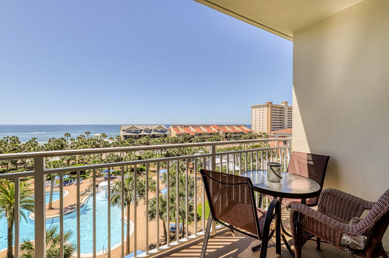 View of the pool and Gulf from a balcony